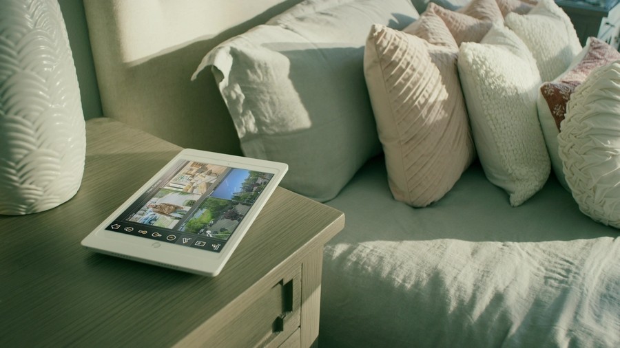 Closeup of an ELAN smart interface resting on a nightstand. 